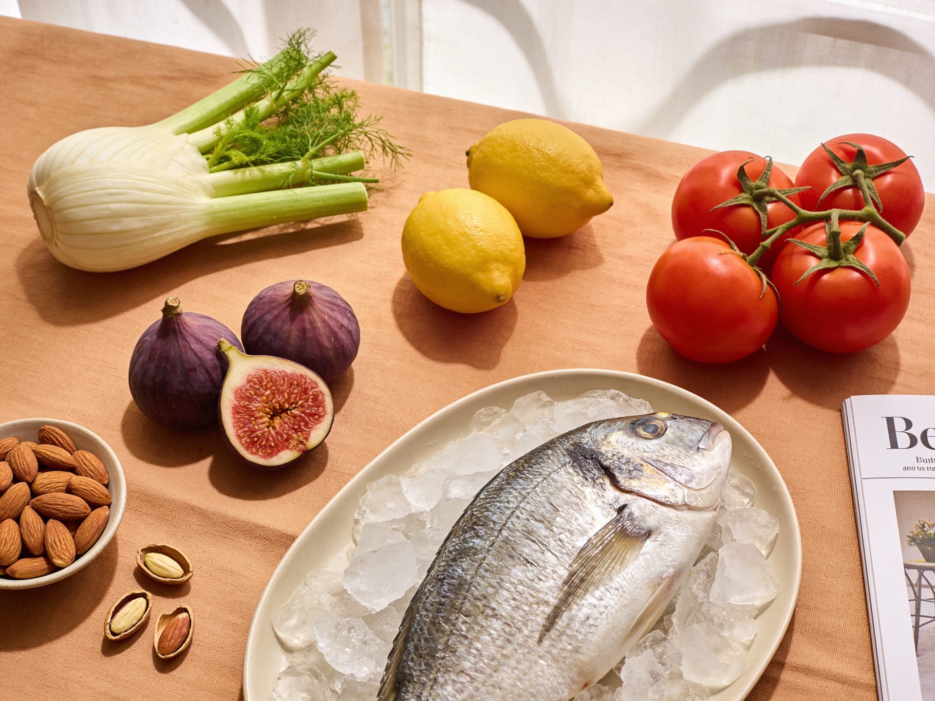 This week's produce: figs, almonds, fennel, lemons, tomatoes and a whole sea bass on ice